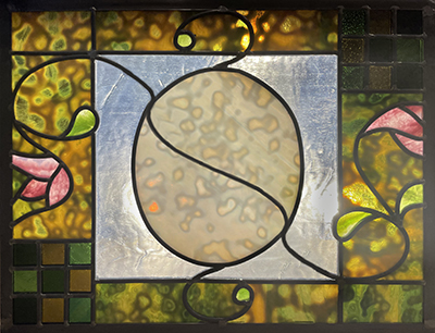 Victorian stained glass design in the shape of an egg