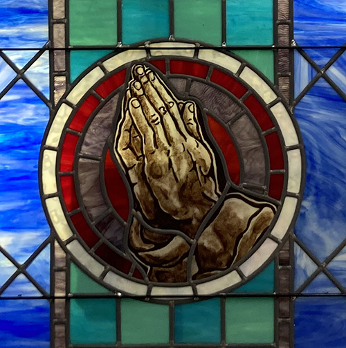 praying hands stained glass